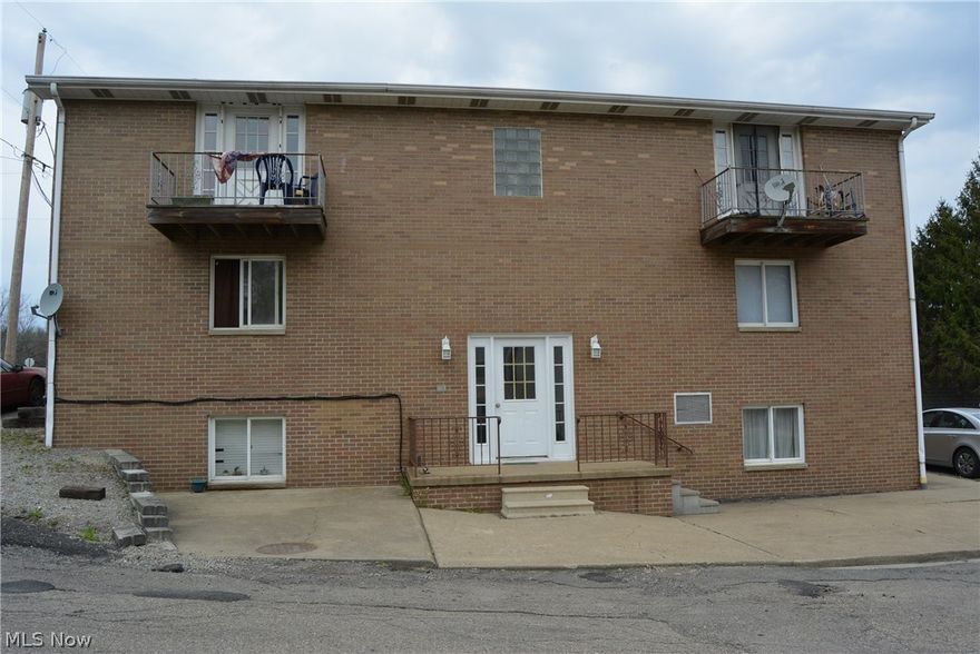 Great investment opportunity! 6 two bedroom units right now currently bringing in $2550 a month. Each unit is nice, laid out, and two of them have balconies. It's a nice brick building with a newer roof. There is a laundry facility in the basement that produces additional income.