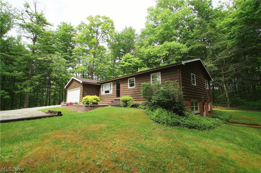 This may be one of the most Beautiful Wooded Settings in Geauga County! Perfectly Set and Quality Built Rough Cut Cedar Sided Ranch has had only 1 owner and has been well maintained. You will love spending time in the Kitchen which is Open to the Family Room with a wood burning fireplace. From here walk out on the private tiered deck with lovely views. Walkout lower level has lots of light and a rec room. Huge 4th bedroom is also in the lower level. Approximately 2000 sq ft of finished living space. Some other features include a heated garage, central air, newer roof and gutters and new Paver front walkway. Outdoor shed for patio furniture and tools gives you lots of space for everything. Come and Take a Look and you will want to stay!