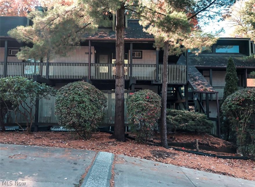 Welcome to this amazing condo in the beautifully wooded Timber Top Community of Cuyahoga Falls. This two bedroom condo is very spacious with two living areas on the main level including a wood burning fireplace and deck overlooking the park. The kitchen appliances stay and the added bar/counter makes for great gathering place for meals or parties. The walk out lower level includes to large bedrooms, a full bathroom and a convenient laundry in between both bedrooms. The laundry room has great storage space or could be used as a third bedroom if needed. The walk out door leads to a great patio that is nestled in the woods making the back very private for condo living. Close to all shopping, parks and conveniences that Cuyahoga Falls has to offer.