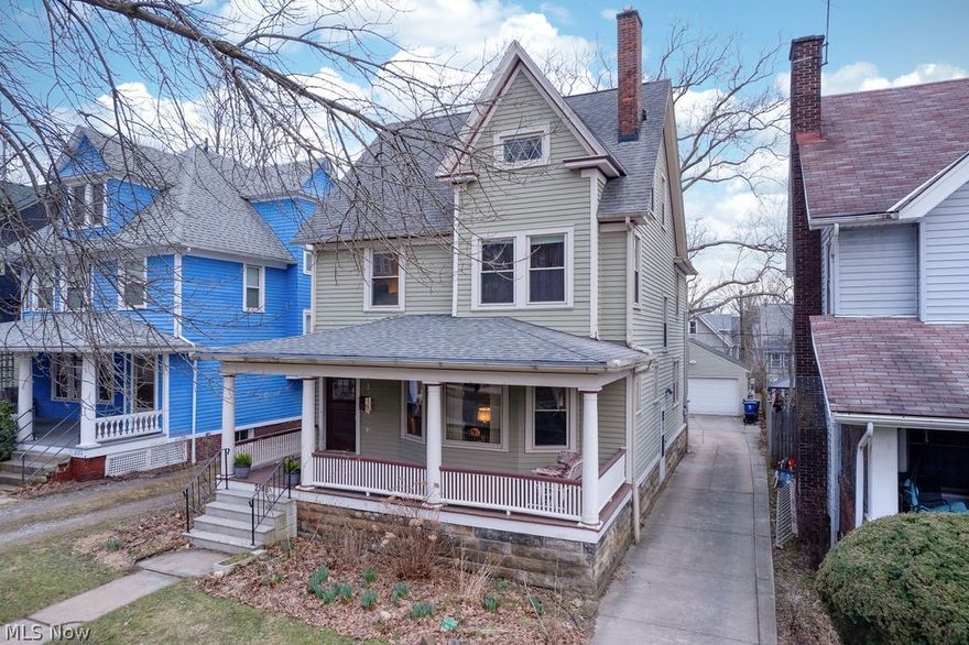 Historic charm in the heart of the Cedar Fairmount District! Built in 1900 in one of the first neighborhoods established when Cleveland Heights was founded, this home is a beautiful example of the area’s enduring architecture and character. Many original details remain intact, while thoughtful updates and careful maintenance ensure it lives comfortably today. The current owners have cherished the home for 14 years, continuing its legacy of stewardship. Step inside to a grand foyer with sightlines in every direction, showcasing the craftsmanship that defines the home: leaded glass windows, wood columns, pocket doors, beautiful newel posts, and original hardwood floors. The kitchen has been thoughtfully renovated to complement the home’s historic style, including cabinetry designed to match the originals and a charming plate rack crafted from a reclaimed shelf discovered during exterior masonry work. The second floor features four bedrooms, including one adjoining the primary bedroom that can create a spacious suite if desired. The hall bath retains its original clawfoot tub and was recently refreshed (2025). The third floor offers exceptional flexibility with a spacious fifth bedroom, full bathroom, and bonus room ideal as a bedroom, office, or creative space. Outside, low-maintenance perennial gardens provide color throughout the seasons. Enjoy a coffee and pastry from nearby Luna Bakery on the expansive front porch or watch the sunset on the back deck. Updates include: kitchen appliances 2024, whole-house water filter 2023, HVAC 2018, hot water tank 2016, new garage 2013, and electrical panel 2013. Ideally located just steps from Cedar Fairmount shops and restaurants, with easy access to Roxboro playground, Elementary & Middle Schools, Shaker Lakes and trails, University Circle, and Downtown Cleveland.