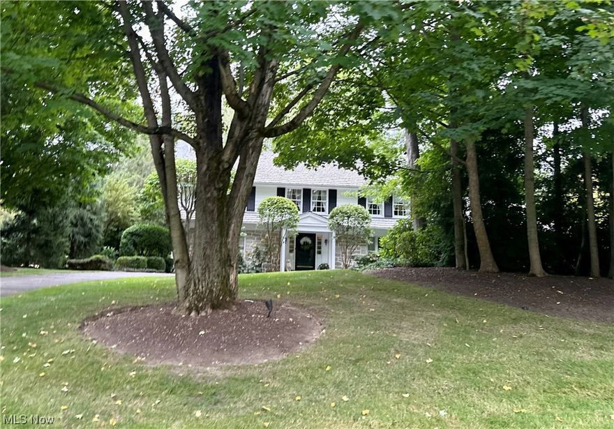 Beautiful colonial in highly desired Landerwood Estates.  A slate floor welcomes you into this lovely home.  The living and dining rooms are large and designed for family gatherings.  The family room addition provides built in bookcases, a grand fireplace w/wood beam mantle, & windows/doors across the entire back of the home to the expansive deck. The kitchen w/ it's skylight & oversized island make this home a pleasure to entertain in. Built in linen drawers, a baking station, lighted cabinets, huge sub zero fridge & freezer, double oven & warming drawer, pantry, numerous cabinets & work station; and the list goes on... A first floor laundry leads to heated garage with work sinks and tons of storage cabinets. Upstairs there are 5 bedrooms and 3 full baths.  The master suite has his/her closets, a soaking tub and stall shower, double vanity w/ corian countertop.  Two oversized bedrooms share a jack & jill bathroom w/ bathtub and separate shower.  The 4rd & 5th bedrooms are tandem & provide large closets & space for a hobby or playroom, plus another full bathroom.  Note the hallway cleaning closet w/sink. Lower level hosts a 2nd kitchen w/5 burner gas cooktop, double ovens & sink, lazy susan & numerous cabinets.  The carpeted rec room is perfect for an office or theatre room. Additional storage closets are a big bonus.  The amazing landscaped yard w/ custom lighting & sprinkler system is heaven to relax & enjoy the private wooded yard. A lovely house you can make your home!