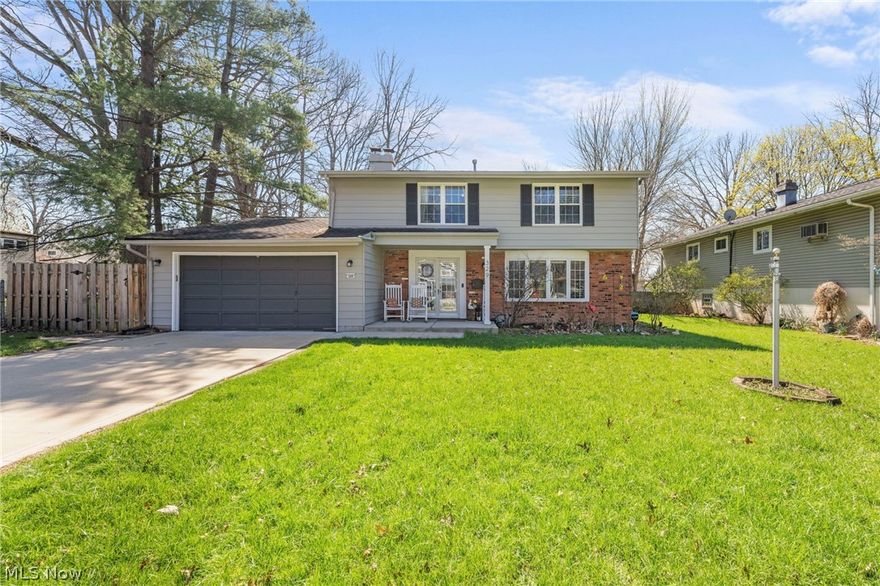 This Berea Colonial perfectly blends classic elegance with a cozy, inviting atmosphere, featuring a flexible floor plan designed for modern living. Step through the elegant French doors to be greeted by a bright living room where a stately bay window floods the space with natural light. The home flows naturally into the dining room, a versatile space ready for everything from weekday meals to hosting holiday dinners. From here, double doors lead to a stunning, fully remodeled year round sunroom (2022), a light filled sanctuary with beautiful stone tile perfect for a professional home office, playroom, or yoga studio. Sliding doors with integrated blinds offer easy access to the expansive wood deck, blurring the lines between indoor & outdoor living. The kitchen is a chef’s delight, featuring a stylish cosmetic refresh (2019) with smoke grey cabinetry, stainless appliances & a rustic stone backsplash that overlooks a warm hearth style den. This showpiece room serves as a unique retreat with authentic half log siding & a floor to ceiling river rock fireplace, creating a cabin style escape for cozy movie nights. Practicality is key with a refreshed half bath (2023) & a main floor laundry room conveniently located off the den. Upstairs, you will find three spacious guest bedrooms & a primary suite that serves as a private getaway with "his & hers" closets & an en suite bath. This level also features a rare, oversized walk in storage closet with a window & shelving to keep the home organized & bright. Outside, the deck is ideal for summer barbecues & overlooks a fully fenced yard with a durable PVC shed. An attached 2 car garage offers effortless convenience, while a fresh exterior paint refresh (2024) provides immediate curb appeal. Located in the heart of Berea, this move in ready home is minutes from the scenic Rocky River Reservation, Coe Lake & Baldwin Wallace University.