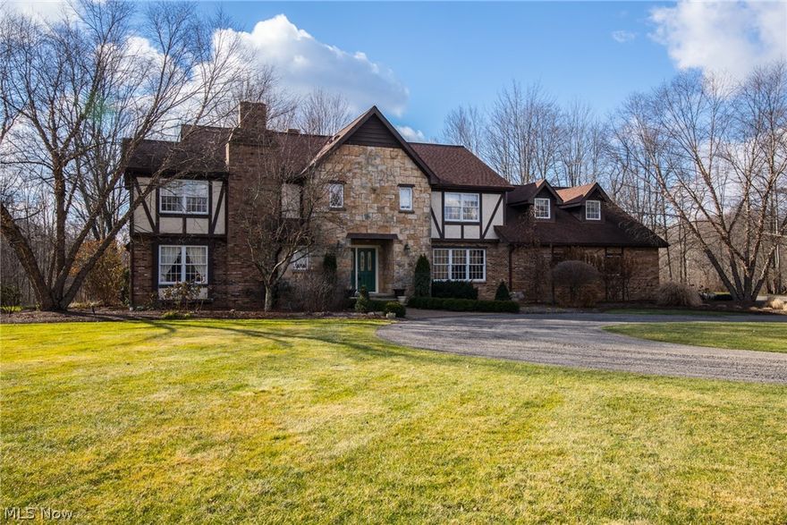 This exquisite home sits on 3.8 acres of beautiful private terrain.  Move in and enjoy immediately.  This classic colonial features living room with fireplace,
gracious dining room, family room with views to backyard, extremely spacious kitchen and a lst floor laundry room.  The cooks' kitchen is spacious enough to prepare for dinner as well as entertain as you do so.  It has newer appliances (which all stay), walk in pantry, hardwood floors, open eat-in area with a fireplace!   Granite counters and wonderful cabinetry complete this picture.  Inviting laundry room which has outside rear entrance as well as an entrance to the kitchen.  
The second floor hosts a large romantic master suite with updated glamour bath as well as a separate office with a fireplace.  3 additional bedrooms and full bath are on the 2nd floor.   However, the big surprise is a bonus room with a separate staircase to the lst floor has a multitude of uses (guest room, playroom, nanny suite and more).  And if this