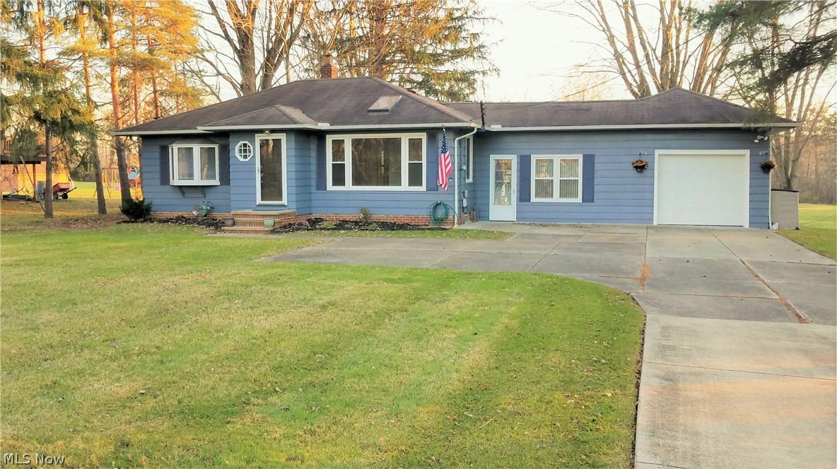 Come see this spacious open floor plan on this ranch style home, three bedrooms, two FULL bathrooms and a huge finished basement complete with your very own bar. This home was completely redone with tons of upgrades in kitchen and bathrooms, hardwood floors through-out, kitchen boasts granite counters and stainless-steel appliances. Step downstairs to find yourself at your very own great room complete with bar and granite counter top to serve all your family and friends along with 3rd bedroom and 2nd full bath. The garage is immaculate with epoxy painted floor for that master mechanic, complete with a 100-foot driveway with plenty of room for all your guest and family to park. Fun doesn't end there, take a step outside of the eat in kitchen and grill out on the large step-down patio. With over an acre and half the yard will never get boring for the kids. Additionally, this home was tied into city sewer and water unlike most homes in the area. Contact our agent for a showing today!