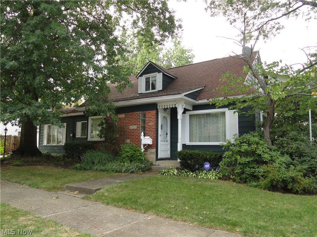 Charming Cape in desirable Cuyahoga Falls location. Formal living and dining rooms, updated kitchen with newer appliances, laminate floors, breakfast bar, overlooks spacious family room with fireplace. Beautiful hardwood floors in most rooms, two bedrooms on first floor with full bath and a huge second floor bedroom with walk in closet. Nice rec room in lower level plus second full bath. Attached garage plus fenced patio area. Newer roof, water heater, furnace & AC too. This well built home with great floor plan has been well maintained for many years.