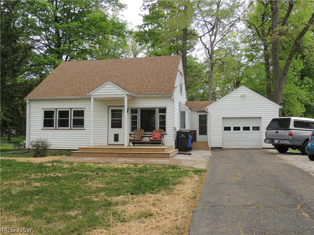 Cozy Cape Cod on parklike lot located on outskirts of town near hiking/biking trail. Current owner did major updates to this home to include major kitchen rehab opening up wall , adding butcher block eating bar, glass subway tile backsplash, granite countertop, vinyl plank flooring, and brushed stainless appliances. Both baths updated and refreshed. Second floor has newer engineered hardwood flooring. Master bedroom on second floor with full bath. Living room and first floor bedroom have newer carpet 2017. Sliding door off breezeway to new deck installed 2016. Roof on home 2014. Not much to do but move in and enjoy.