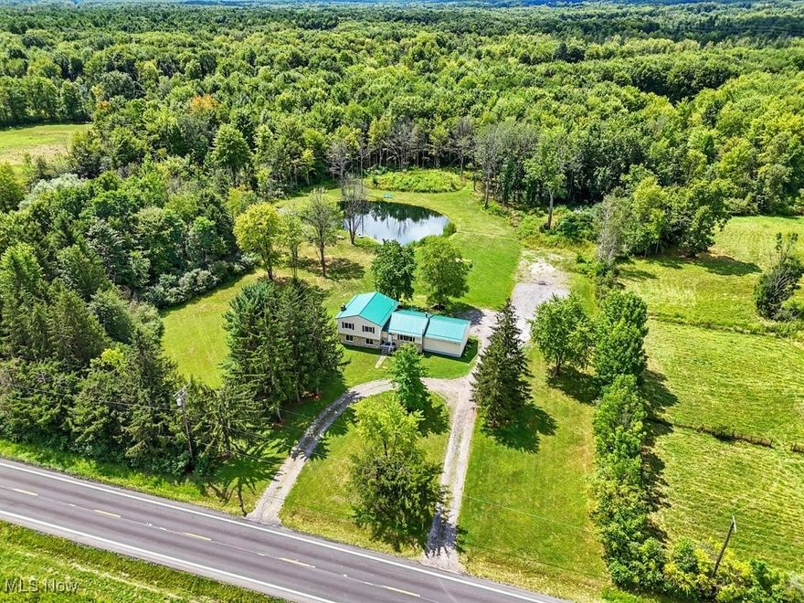If “wide open spaces” is your love language, this split-level on nearly 12 acres delivers in style! Fully remodeled in recent years, you can move right in and skip the to-do list. In 2025, the seller went the extra mile and replaced the flooring, so everything underfoot is fresh and fabulous. The bright, eat-in kitchen is a dream with white cabinets, new light fixtures, granite countertops, and stainless steel appliances. Your have a spacious primary suite and two additional bedrooms that are just as generous—plus, closets for days. Two living rooms or a huge dining room, this is a flexible floorplan and the lower level steals the show: huge, cozy, and complete with a walkout to the backyard and a pellet stove. And a pond? Yes, please! Sunrise reflections, afternoon swims, a healthy established garden and maybe even a little moonlight dip--right outside your door. This 4-level split offers 2,174 square feet of living space, plus another 624 square feet in the basement—perfect for storage now or ready to finish into a home gym, media room, workshop, or guest suite. Overhead, a durable metal roof gives you peace of mind for decades—no shingle replacements every time the weather turns. It’s low-maintenance, energy-efficient, and just plain good-looking.Outside, just under 12 acres of pure possibility await: ATV trails, hunting, horses, livestock, or your own personal nature preserve. The pond is 1/3+ acre and 14 feet deep at its deepest point. Need parking for all your friends when you host? The driveway has you covered—with an extra circular drive out front and PLENTY of parking out back for good measure. If you’ve been craving a place where mornings start with coffee on the deck overlooking your private pond and evenings end under a sky so big and starry you forget there’s such a thing as rush hour—THIS IS IT. A true country sanctuary, top-to-bottom updates, and just the right touch of wild freedom to breathe deep, roam, and live life your way.
