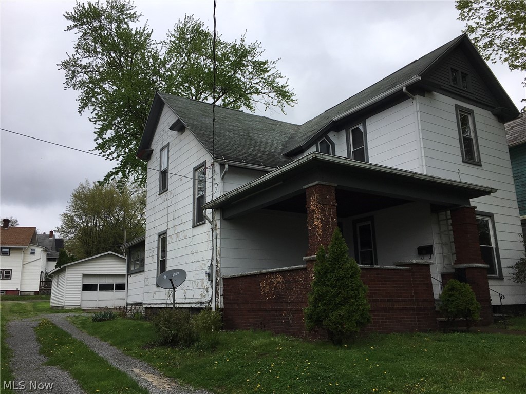 Great opportunity in Wooster! This home is nearly 2000 square foot, with 3-4 bedrooms and 2 full bathrooms. The huge front porch is a great space for entertaining and enjoying a nice day. Enter into the foyer, where you will immediately notice the tall ceilings and so many beautiful and original features of the home. The bright, formal living room features the original fireplace and mantel (not working). Opening up into the large den/family room, with ceiling fan. Then to the formal dining room and kitchen, both with ceiling fans. The kitchen has laminate floors and a range and refrigerator, that stay. Off of the kitchen is the enclosed back porch and other side, an exterior door, basement access and a full bath. The bathroom has a walk-in shower and laundry area with washer and dryer that stay. Up the charming stairway to the second floor. Be sure to notice the unique window in the hallway. The master bedroom is connected to a bonus room. This could be a nursery, 4th bedro