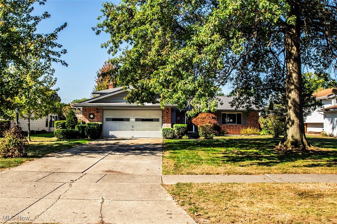 This classic 3 level split on a generous lot is ready for you! Step inside the entry foyer to the main level and discover a spacious open floor plan featuring living with vaulted ceiling joining dining area to create the ideal space for entertaining. The sizable eat in kitchen boasts plenty of cabinet and counter space with stainless steel appliances included. A few steps down to the lower level you'll find a generous family room with wood burning fireplace and walk out to a private shaded fenced yard with covered patio and attractive 12x8 storage shed. The lower level also includes utility area and a convenient half bath. The upstairs features four bedrooms including a roomy master with dedicated bath and a guest bathroom. Recent improvements include newer carpeting, vinyl windows, roof and foam insulated walls and more. Hurry to see this one!
