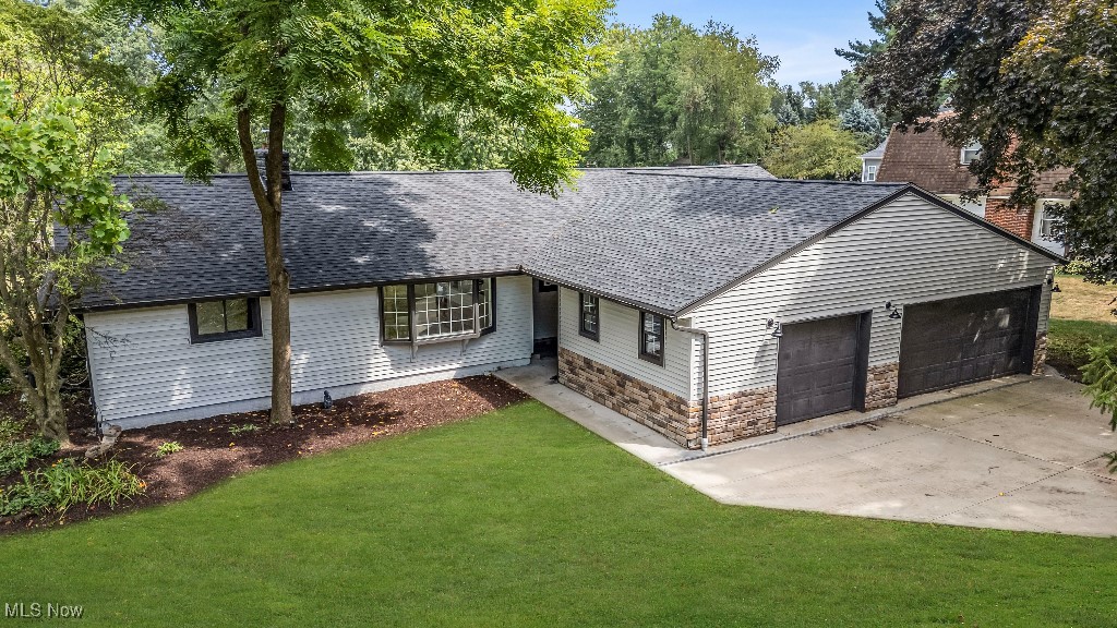 WOW—The one you’ve been waiting for! Welcome to 5550 West Blvd NW, a stunning lakefront retreat on the peaceful shores of Lake Cable. This beautifully updated home blends luxury, comfort, and outdoor living. Enjoy incredible curb appeal with fresh exterior paint, a spacious multi-level deck, private boat dock, and a large backyard—perfect for entertaining or relaxing. Inside, the open layout features a welcoming living room, generous dining area, and a show-stopping kitchen with stainless steel appliances, modern cabinetry, premium countertops, and a stylish backsplash. A bright family room off the kitchen adds more space to gather. The private primary suite includes ample closet space and a full ensuite bath. Two additional bedrooms offer comfort and flexibility. The oversized 3-car garage is freshly painted with recessed lighting—great for storage or hobbies. The finished lower level opens to the backyard and adds even more living space—ideal for hosting or enjoying quiet lake views. Enjoy full access to Lake Cable amenities: boating, swimming, kayaking, fishing, paddleboarding, and a private beach. Don’t miss your chance to own this exceptional lakefront home. Schedule your private showing today—5550 West Blvd NW won’t last!