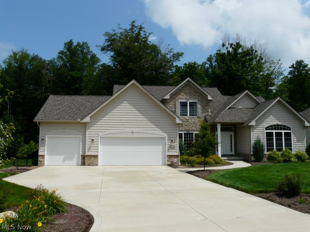 Spectacular Customized 2-Story Colonial with plenty of natural light! Professionally Decorated with many Upscale Amenities! Nature Lover's D and both doors have openers. . The large basement (with high ceilings) has glass block windows and is plumbed for an additional bathroom. Entire front, rear and side yards were meticulously landscaped with all new mulched flower beds, trees, and a gorgeous stamped concrete patio that leads all the way around to the front driveway (includes high end lighting built into the steps!) The beautiful views out the rear of the home are protected by a dedicated green space behind the property! The granite counter tops run into the kitchen, laundry room & all the bathrooms. The open kitchen has a wall of sliding glass doors, ample cabinet space, island area and desk. The wood floors adorn the open floor plan from the kitchen into the great room, dining room and den. No details were left untouched with the open foyer and the stunning stairwell that overlook
