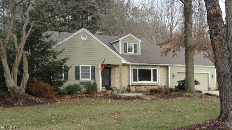 Spacious 3 bedroom, 3.5 bath stone and cedar 1.5 story home.  Cherry raised panel doors throughout with over sized cherry trim.  Amish made woodwork!  Cherry crown molding in the living room with a wood burning fireplace.  Sunken family room with sliding glass doors to the canvas covered patio.  Custom hickory kitchen with maple hardwood floors.  A sitting room located off the first floor master bedroom leads to a 24 X 12 screened porch.  Finished lower level includes a rec room, laundry room, study and half bath.  24 X 30, 2 car attached garage.  The private backyard is a peaceful retreat featuring a putting green, grape arbor with stone floor, 40 X 45 basketball court, 9' Martinelli pool and more.  Anderson windows.  Updates throughout the home include a new gas heater for the freshly painted pool in 2014+/-, new salt water system for the pool in 2013+/- which makes the pool very low maintenance, new roof, furnace and central air in 2012+/- and a new hot water heater in 2010+/-.  Excellent location in the lagoon.