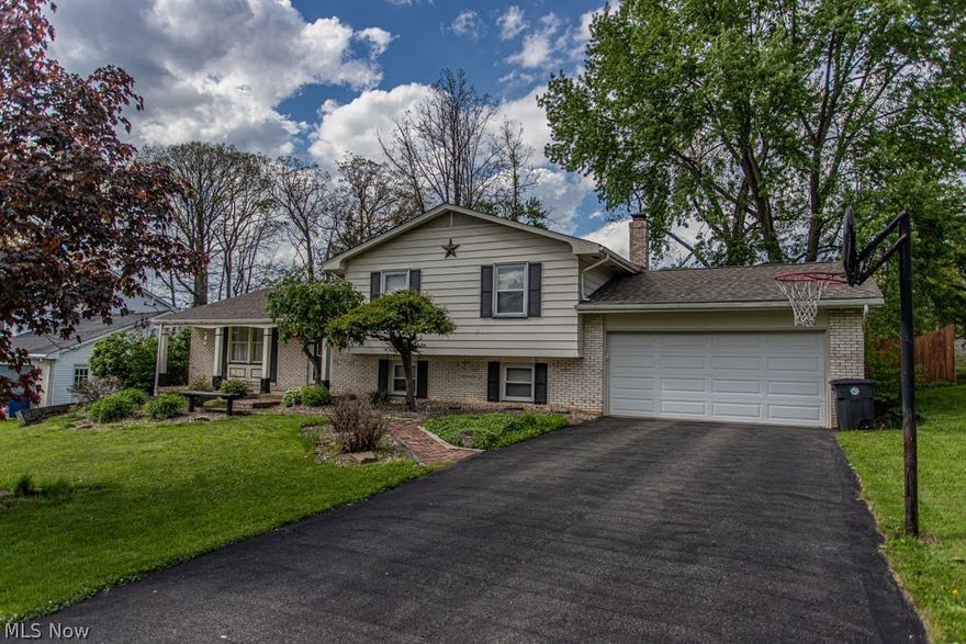 Spacious 4 level Split in Howland Twp.  Refinished natural wood floors throughout main living area, and neutral paint throughout.  Modern kitchen with stainless steel appliances included.  Formal Dining area with sliding glass doors to enclosed patio and privacy fenced back yard.  Upstairs you find 3 large bedrooms, and 2 full bathrooms.  Downstairs has endless possibilities, with first a large family room with gas fireplace. Next to recreation room with full wet bar, and vinyl title flooring.  The finished basement is set to be a Entertainment Theater Room, with a pull-down projector screen for movie nights.  A MUST see before its gone!  Americas Preferred Home Warranty is included.