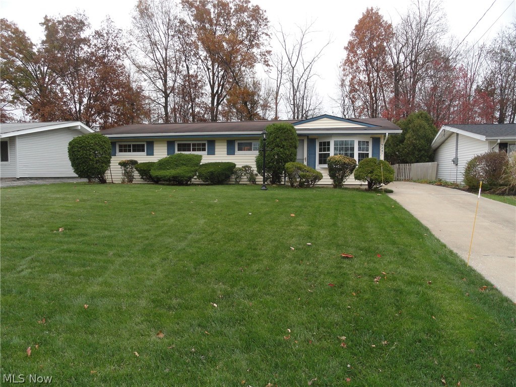 Welcome home to this 4 bedroom 2 full bath Ranch in Northfield Village. A very well maintained home with an updated kitchen, updated master bath, newer carpet, new windows in '15 and new HVAC in '09. A cathedral ceiling in the living and dining room creates a great open and spacious feeling. Sliders from the dining room step out to a huge patio/parking area and a 2 car garage with extra workshop. The backyard overlooks a wooded area for extra privacy. All appliances included plus a home warranty too! Don't hesitate to call today!