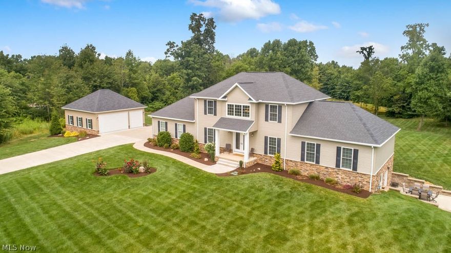 Stone pillars flank the gated driveway as you make your way towards this 6 bedroom, 3.5 bath dream home situated on 10 incredible acres! Built in 2013, this 7-year-new house offers a 1st floor master suite, 6-car garage and finished lower level. Greet your guests in the sun-filled 2-story foyer then socialize in the stunning great room with soaring ceilings and an impressive floor-to-ceiling stone gas fireplace. Find your culinary inspiration in the gorgeous kitchen with KraftMaid cabinets, granite counters, Kenmore Elite stainless steel appliances, an island with a sink and breakfast bar plus a pantry with pull out drawers! A large laundry room and half bath down the hall as well as an office at the front of the home. Huge 23x19 first floor master suite offers a walk-in closet and a private full bath with a tiled walk-in shower, multiple shower heads, dual sinks and a soaking tub. Upstairs, there are 3 bedrooms with good closet space and a full bath with tile shower surround. Bathroom