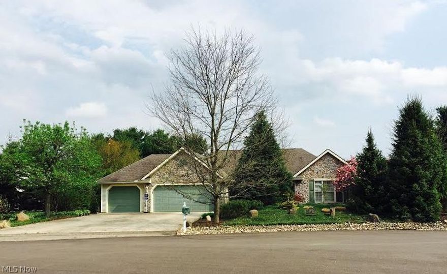 Escape To The Oasis This Custom Built Two Bedroom Ranch Home Offers With Its Professionally Landscaped Private Yard…. Perfect For Entertaining! This 1767 Sq Ft Open Floor Plan w/Custom Wood Working Through Out Features  Many Windows That Flood The Home With Bright  Light & Warmth. Split Bedroom Design Works Great For Guests.  The Front Porch Invites You Into The Foyer Overlooking A 23x15 Great Room w/Cathedral Ceiling/Surround Sound & Custom Stone Gas Fireplace. Open Fully Applianced Kitchen w/Custom Cherry Kabinart Cabinets/Breakfast Bar Includes Pendant Lighting/ Pantry. Dinette Area w/Bayed Window Offers Front Yard Views. The Formal Dining Room Has Wall Of Custom Cabinetry. Master Bedroom w/Cathedral Ceiling Includes Full Luxury Bath w/His & Her Walk In Closets. Spacious Second Bedroom w/Double Closet & Full Bathroom.  Laundry & Mud Room Area. Deep 3 Car Garage Offers 2 Sizeable Areas For Parking Plus Plenty Of Storage Space Along w/heat-Temperature Controlled/Utility Sink/Hot Cold