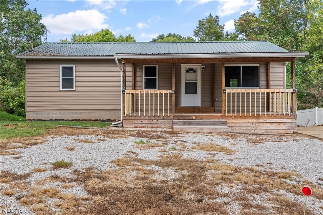 Looking for a country getaway while still being minutes from town? This cute single-story ranch with a walk-out basement could be that place. This peaceful setting offers a one-acre lot with a large front porch and a rear deck to enjoy the lovely view. The good-sized kitchen opens to the dining area and living room for an open concept feel along with nice-sized bedrooms to complete the first-floor living. The large walk-out basement offers tons of opportunities to expand your square feet and increase the property value. This is a great opportunity for a first-time buyer or someone looking to scale down and relax outside city limits. Schedule your tour today.