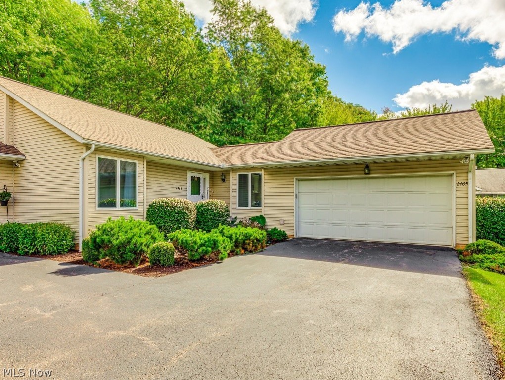 Enjoy maintenance free living in this rare, end unit ranch condominium that I bet you thought you’d never find. Beautiful from top to bottom, this home offers the traditional benefits of a condo with the spaciousness of a single family home! The living room is big, features a gas fireplace and has a pretty, wooded view. The kitchen is newly-remodeled with an ample supply of bright white cabinets, granite counter tops and appliances that stay. First floor laundry is close by, too! The master suite has two full closets and a bath with a walk-in shower, an over-sized vanity and a linen closet. If you have anyone who visits with special needs, you'll appreciate the extra wide hallways as well as the safety and convenience of a second bath with a high-end walk in tub/shower. A real jewel is the all-season sun room with soaring ceiling and walls of windows. It will be wonderful for entertaining and decorating at the holidays. This room leads to a pretty deck featuring Brock decking and moder