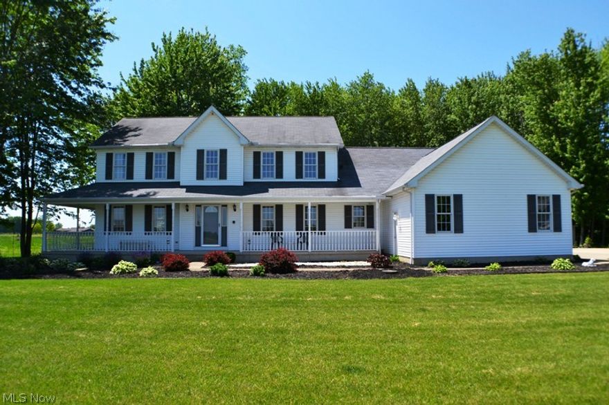 Stunning Colonial on nearly eight acres.  Features include spacious living and dining rooms, vaulted ceiling family room with gas log fireplace, wonderful kitchen with Corian counter tops, island, pantry and hardwood floor, first floor laundry room with washer and dryer, outstanding master suite with sitting area, two 5' x 11' walk-in closets, full bath with whirlpool tub and shower stall, wonderful basement with finished rec room with half bath, additional living suite with separate entrance with two bedrooms, full bath, kitchen with appliances, living room and sun room.  Additional suite is perfect for in-laws and guests.  Three car attached heated garage with Genie ProMax operators with steel insulated doors, hot and cold water and pull down stairs to overhead storage.  Fantastic free standing 40' x 24' additional 3 car garage/workshop with wood burning stove.  Wrap-around porch, 16' x 16' covered Trexx deck, fenced yard, Gutter guard, one year HMS home warranty and much more!