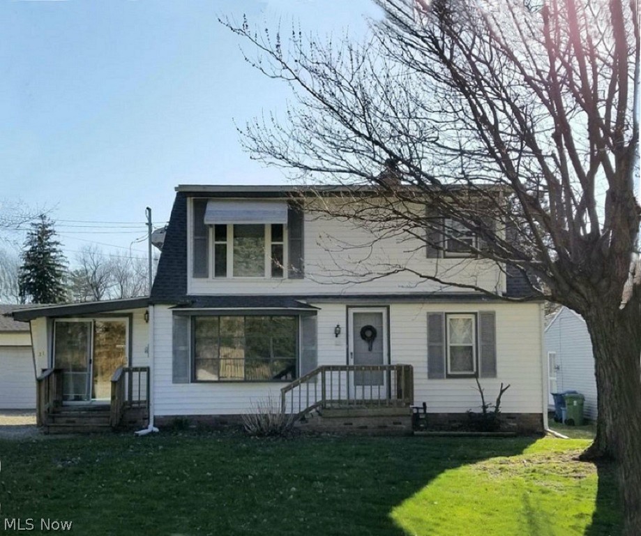 Have the garage and workshop you’ve always dreamed and an affordable 4-bedroom home ... all in one! Located on the border of Tallmadge in a wonderful, established neighborhood, this home has so much to offer. There’s a first floor bedroom and three upstairs. The eat-in kitchen is a nice size, with loads of cabinets and all of the appliances, including a newer French door refrigerator. You’ll love having an enclosed porch to sit out on. There’s a pretty bow window in the living room, some vinyl replacement windows throughout the house and brand new carpet in the living areas! The huge 22-ft. long family room will have you feeling like you’re in a lodge, on vacation. The owners used it all of the time for big family gatherings. The former owner had a siding business and used the oversized garage and sizable attached workshop to store and prepare materials. Improvements include (approximate years) new furnace and central air in 2018, bathroom remodel with a big walk-in shower 2017, th