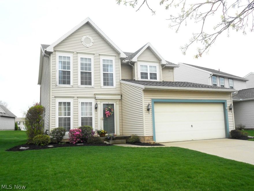 Beautiful colonial in desirable Coventry Crossing.  Sharp 4 bedroom, 2.5 bath home is well maintained with stylish decor and pottery barn colors.  An eat-in applianced kitchen plus a dining room and formal living room create a warm and inviting atmosphere.  The cozy family room has easy access to the kitchen and leads to the patio for entertaining family and friends.  Master bedroom with lots of natural light, offers a walk-in closet and bath with double sinks and garden tub.  Convenient second floor laundry (washer & dryer included) makes doing the wash less of a chore.  Roof was replaced (tear off) in 2014.  This family oriented neighborhood features a great community park with splash path and planned events.