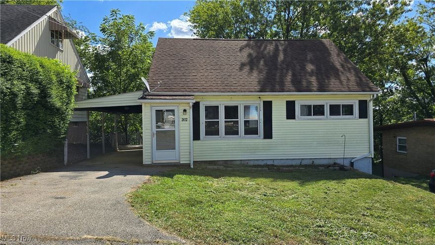This cute hillside charmer is ready for new owners!  Perched on Highland Ave, this home is just across from the City Park tennis courts, offering convenience to exercise and recreation activities.  The home has 3 bedrooms, with 2 on the main level and one in the finished attic space.  Most of the home has original hardwood floors, and the home has had vinyl replacement windows installed for added efficiency.  A roomy kitchen leads to a back room that could be either a family room or formal dining space.  The basement has a large finished space, as well as 3 separate unfinished rooms for storage or hobbies, with walkout access from the back room. In addition to the attached carport, there's a detached 2-car garage out back with access from the alley that dead ends at the next property.  This home has no shortage of storage or parking!  With just a little freshening up with your own custom touches, this home will offer the space and convenience you've been looking for at an affordable price!