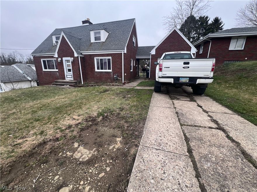 Brick Home with 1 car garage and breezeway up for your consideration.  Nice size back yard. Located near amenities. Fixer-upper with potential.