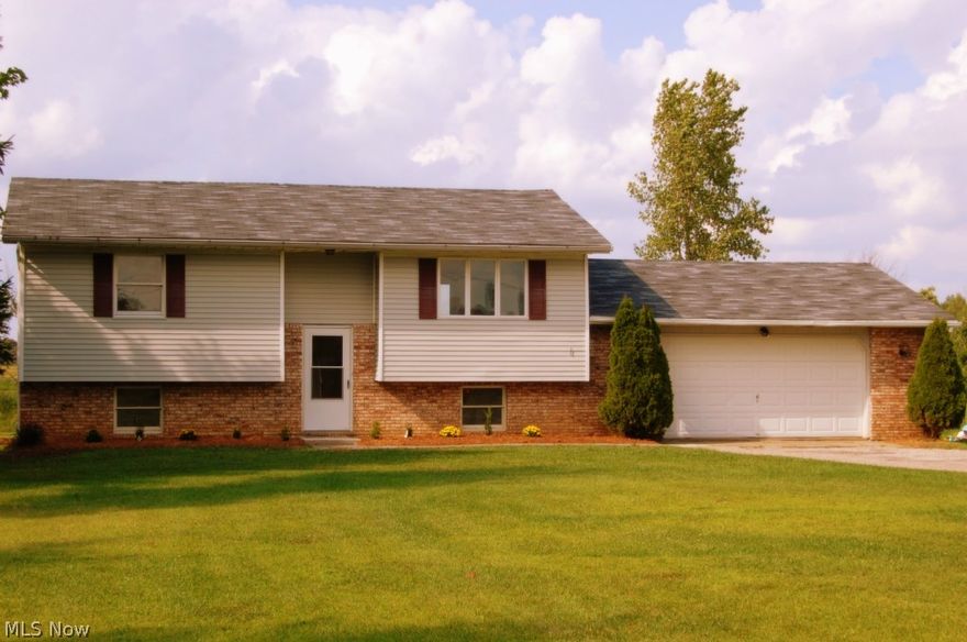 This home is located in an ideal location for anyone looking to escape to the country. Situated on a dead end portion of Law Road, it offers the homeowner exceptional peace and quiet with minimal traffic. The kitchen and both bathrooms have recent updates including ceramic tile floors and oak cabinets with granite counters in the kitchen. Enjoy the panoramic view behind the home and entertain your friends on the large deck. The attached 2 car garage has plenty of extra room for work benches and storage. A new roof was installed in 2013. New aerator for the septic system installed in 2014, and there is a 3 pump sump system. The home is hooked up to county water but there is a cistern on the premises that could be used for a irrigation/sprinkler system. New carpet installed and this home is ready for occupancy.