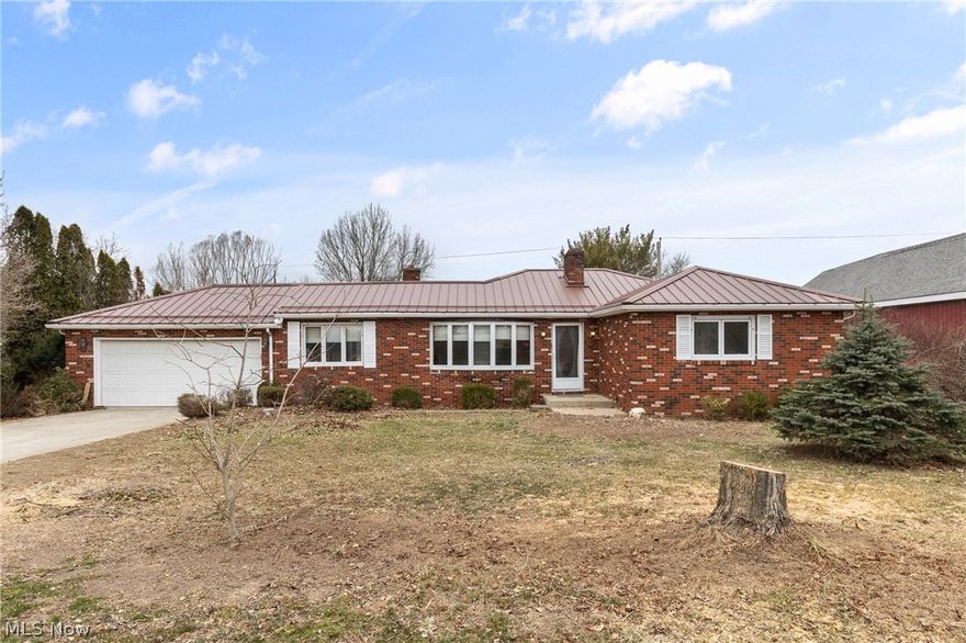 Welcome to 70828 Crescent Rd in St. Clairsville, Ohio — a solid brick ranch situated just outside the city limits, offering the space and freedom you’ve been looking for with the convenience you need. Positioned on a flat 2.19-acre lot, this property is a rare find. The expansive, level ground opens the door for endless possibilities — whether you envision a hobby farm, garden space, recreational area, or simply room to breathe. Mature fruit trees add charm and function, creating a picturesque setting with seasonal harvests right in your own backyard. The home offers a practical and efficient one-floor layout, making daily living comfortable and accessible. Inside, you’ll find a functional kitchen with ample cabinetry and workspace, flowing into the main living areas for easy everyday living. Garage and storage space truly set this property apart. In addition to the attached garage, there are two large outbuildings/garages — ideal for car enthusiasts, contractors, hobbyists, or anyone needing significant workspace and storage. Whether you need room for equipment, recreational vehicles, or a workshop setup, this property delivers. For added peace of mind, the home has been pre-inspected, and several items identified in the inspection have already been addressed — a proactive step that adds confidence and value for the next owner. If you’ve been searching for a well-built brick ranch with acreage, flat usable land, and exceptional garage space in a desirable St. Clairsville location outside city limits, this property deserves your attention.