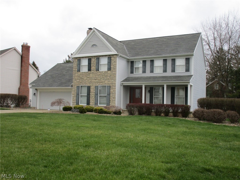 Mint Condition 4 Bedroom Colonial Home located in the Heathers! This Home is impressive in every way and reflects true Pride of Ownership. The Formal Living Room boasts Floor to Ceiling Windows and Crown Molding. The Beautiful Dining Room will support a large gathering. The Family Room is a Stunner with a Brick Gas Log Fireplace and Gorgeous Hardwood Floor. The Very Spacious Kitchen will not disappoint with a nice bright Dinette Area, a Center Island with a Cooktop and Breakfast Bar. There are loads of beautiful Cabinetry and a built in Planning Desk. The First Floor is completed with a Half Bath and conveniently located Laundry Room just off of the Garage. All Four Bedrooms are located on the Second Floor. The Master Bedroom is awesome - very spacious and relaxing. It has a huge Master Bathroom with Double Vanity Sinks and a Jetted Bath. Just off of the Master Bath is a large Walk in Closet and an additional room currently used as an Office. This could also be a very functional Nursery. The Full Basement with Glass Block Windows provides loads of storage space and an additional Office. The Deep Double Garage has plenty of space. Get ready to spend some quality outside time as well on the Covered Front Porch and Beautiful Back Deck. Don't Delay. Make an appointment to see this Quality Home Soon!