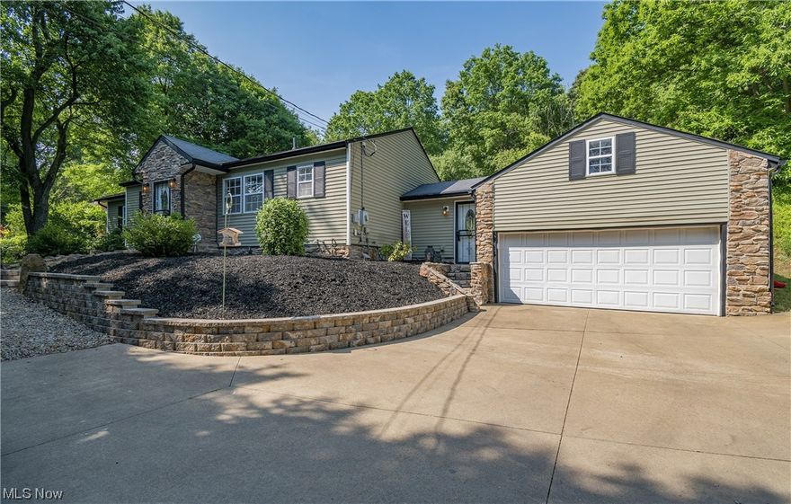 Welcome home to 905 W Turkeyfoot Lake Road! This charming remodeled ranch boasts 4 beds, 3 full baths, 6 garage spaces, and more! The open floor plan main level does not disappoint with its stunningly remodeled kitchen, spacious great room, and new flooring throughout. Your kitchen comes complete with stainless steel appliances, new cabinetry, and a large dining space. Enjoy your main level owner's suite sitting off the living room that features 11 ft ceilings, double closets, and owner's bathroom. Your lower level offers a fourth bedroom and a full bath with a jetted tub. Sitting around the corner is a family room with a wet bar, laundry room, and storage area! Large mud room gives access to a back patio and connects to the two car attached garage with finished loft. Venture outside to find your beautifully landscaped yard and a 4 car detached garage with a 10 ft door for the car and boat enthusiasts! Conveniently located near Portage Lakes State Park! Don't miss your opportunity to o