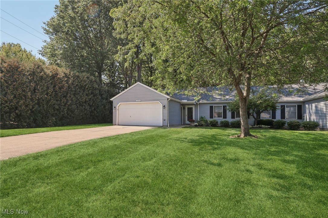 Enjoy the peace and privacy of this spacious 2-bedroom, 2-bath ranch on a premium landscaped lot in desirable Avon Woods. The open-concept layout features a large great room with cathedral ceilings and abundant natural light. A cozy family room opens to a beautiful stone patio and a large backyard—perfect for relaxing or entertaining. The yard and exterior is fully maintained by the HOA for added convenience. The primary suite includes a full bath and walk-in closet. All appliances are included, making this home move-in ready. Don’t miss this exceptional opportunity.
