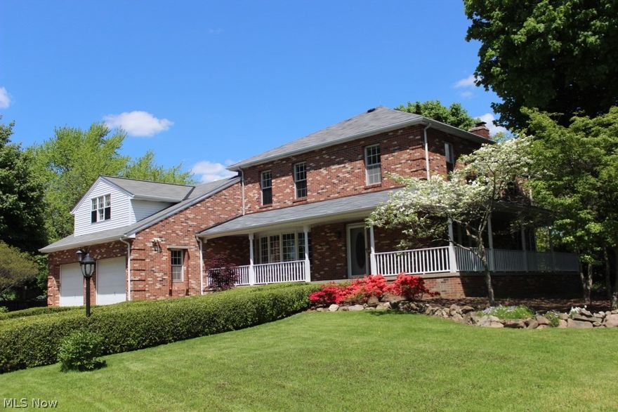 Now is your chance to own a piece of history. A Century Farmhouse with so much charm and personality, it will set your mind adrift and back to a simpler time. Relax on the brick patio overlooking the pool, compete with a slide, a view of the County Club of Hudson Golf Course and a tree tire swing. Unwind on the wrap-around porch and watch the world go by. This lovely home has original wood floors, elaborate moldings throughout the home, 2 fireplaces, a beamed Family Room and an extra large Kitchen. There have been a few additions throughout the years to accommodate the changes in society and have added wonderful space. There are 3 large full baths, a sitting area upstairs, perfect for a study or TV room, 5 bedrooms and a full bath on the first floor. The Dining Room has wood floors and a stunning bay window. There are 2 staircases that just add to the ambiance of this home.