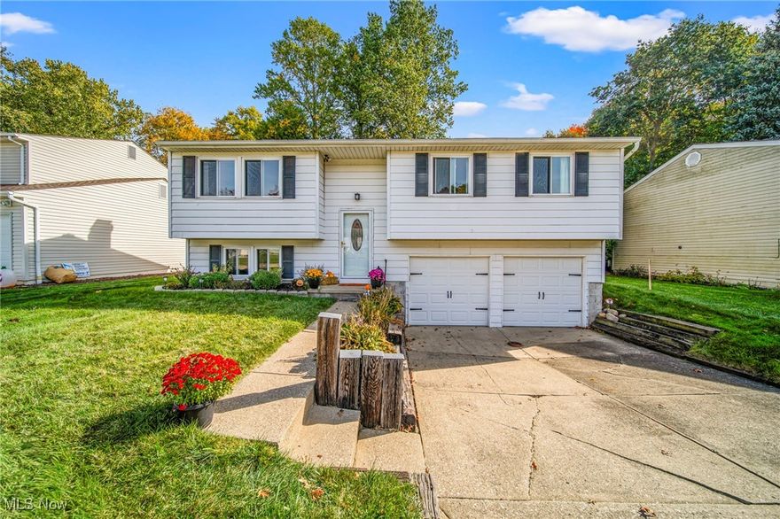 Welcome home to this adorable, well-maintained, and inviting bi-level in Mentor on the Lake! Located near shopping, parks, and highway access, this home is located within a desirable community. Through the front door, and down the stairs, you'll find a finished owner level and a full bath with the area providing ample space for a play area, home office, or storage! On the main level of the home, there are three bedrooms, a full bath, and a spacious living room. The spacious living room leads into the dining room for easy entertaining! Directly off of the kitchen, there is an inviting deck that overlooks a private, wooded backyard - the entire deck was replaced with new wood over the summer! Updates include brand new utility sink, floors and carpets were all replaced within 6 years, new roof in 2020, major appliances are all under 5 years old, brand new garage openers, and a new lawn was installed 3 years ago! Don't miss the opportunity to make this warm and inviting home yours. One year home warranty included! Schedule your appointment today!