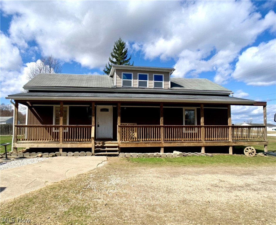 What an adorable, remodeled cape cod style home on almost 2 acres! Country style wrap around porch, detached 2 car garage with lean to off back. Numerous improvements recently completed. Remodeled bathrooms and kitchen- all appliances remain. Home has had new paint, brand new wood flooring and carpet installed 3/23/21 Open floor plan with beautiful views overlooking the backyard with creek to rear of property. Spacious living room with wood burner. First floor master bedroom, bathroom and laundry area. Conveniently located to downtown Garrettsville shopping and in the award winning JAG school district. Immediate occupancy- Start the spring season moving into your new home! Seller will address any and all offers by 6pm on Sunday March 28,2021