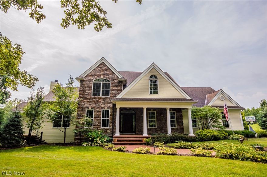 Craftsmanship and attention to detail emanate inside this Immaculate custom built Colonial. The first floor is tastefully accented with an elaborate granite foyer w/marble decorative inlay, crown molding, beautiful hardwood floors and features a large living room complete with a zero clearance fireplace and vaulted ceilings.  The dream kitchen comes with granite counter tops, stainless steel appliances, maple cabinetry, hightop island and dining area with french doors leading to back stone patio. Each of the four spacious bedrooms on the second floor have direct access to a full bathroom. Relaxing is easy in the master suite featuring large bay windows overlooking the back yard, vaulted ceilings, walk-in closets, and a spectacular luxury bathroom with two vanities, tiled shower, jetted tub, and gorgeous granite flooring. The finished walk-out basement with beautiful concrete overlay flooring adds even more living space with a recreational room, sitting room and a full bathroom.  Enjoy