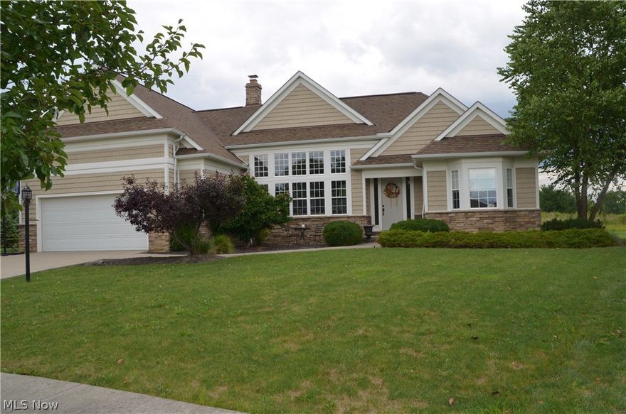 Spectatular Signature of Solon Completely Renovated Home! New Great Room Addition with Vaulted Ceiling, Expansive Windows, custom built Entertainment Center. Entrance warmly welcomes you with Real Hardwood Floors, Custom Stone Fireplace, Amazing Open Floor Plan, Custom Millworking, Charming Staircase, Amazing Light Fixtures.  The Renovated Gourmet Kitchen offers White Cabinetry with large crown moulding to the ceiling, Custom Hood, Stainless Steel Appliances, Thermador range, two Bosch Ovens, Bosch Dishwasher, Microwave Drawer, Butler Pantry Area, Regular Pantry, Granite Countertops.  The Mud Room features a custom built bench with cubbies & a Planning Center/Desk Area.  Charming Laundry Room offers a plenty of counter and storage space, sink, and window.   Large Master Suite has new wood-like flooring, large crown moulding, walk-in closet, and a newly renovated luxury Master bath with Calcutta Marble like tile,  custom shower, tub deck, granite top, dramatic mirror, and white cabinets