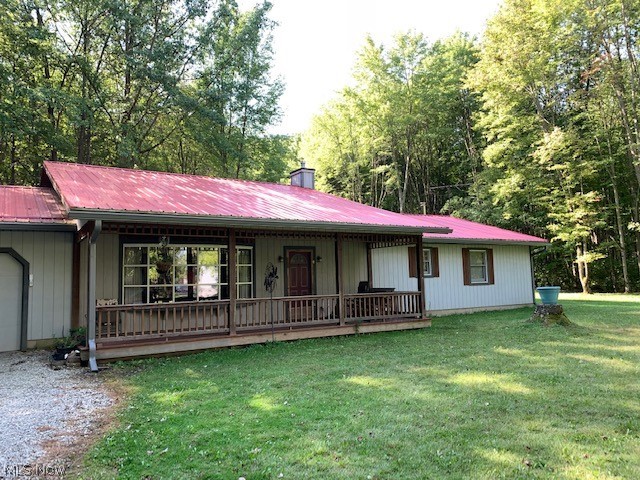 Time to downsize to the country and escape city life? Want one floor simple living? Want to be close enough to Berlin Lake without paying huge home prices? This custom built, open floor plan, ranch home could be your little slice of paradise you have been waiting for. Owners designed this 2 bedroom home specifically with a massive master suite, complete with open soaking tub and sink, private water closet, and entrance into the laundry room. (Maybe close off the master bathroom later?) Additionally, this enormous master suite has it's own wood burner for snuggling in the cold winter evenings. This homes great-room features vaulted ceilings. and two covered decks, one off the front and one off the back! The attached garage is absolutely massive and perfect for storage or a car enthusiast! Situated on 2 acres, the home also has a large barn to store all your tractors and extra curricular toys for the lake! It is still has a dirt floor, so the new owner may want to add a concrete base