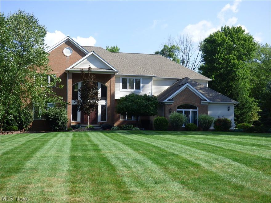 DO NOT MISS THIS PRICE! MOVE IN QUICKLY!! Natural light fills this attractive transitional! 1 ac Private cul de sac setting with wooded back yard! Truly meticulously maintained home! You are greeted by a beautiful 2 story hardwood foyer that opens to all the main rooms on the first floor, formal living, formal dining, 2 story great room, and a very lovely updated kitchen with granite counters and custom cabinets!  There is an office (possible 5th bedrm) on this floor and 2 half baths. Newer refrigerator, stove, dishwasher, washer, dryer!  The second floor has a very spacious master suite with a sitting area, walk in closet, and a double vanity luxury bath with jetted tub! 3 more bedrooms with 2 full baths complete the second floor.  The delightful lower level is great with a recreation room, full bath, and room for many activities!  Daylight windows allow natural light in the basement.  A deck off the main floor to the private yard and a professionally maintained yard complete this lov