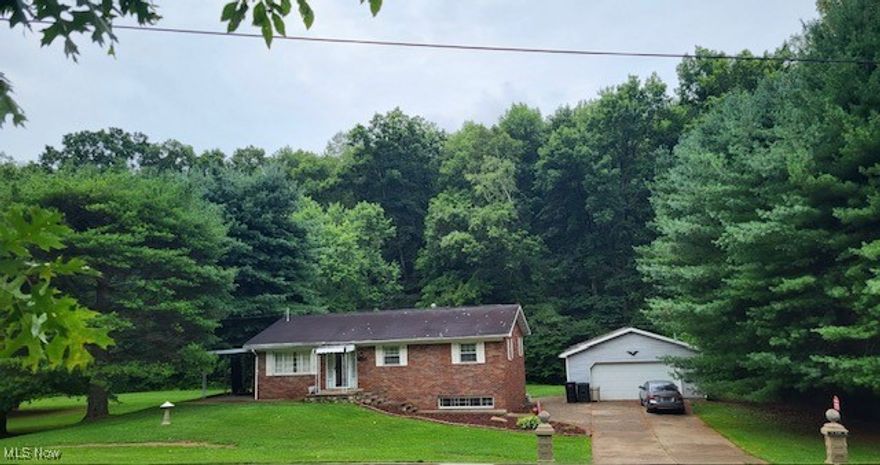 Welcome to this charming and well-maintained brick ranch located in the highly sought-after Warren Local School District. This inviting home offers a perfect blend of comfort and functionality, making it ideal for families and anyone seeking convenient access to local amenities. Inside, you'll find three bedrooms and two and a half baths, including a primary bedroom with a half bath for added convenience. The large eat-in kitchen is perfect for family meals with easy access to the side covered patio area.  The partially finished basement provides additional living space and ample storage options. The detached two-car garage is equipped with water, electric, and heat, making it an ideal workshop or hobby area. Outside, you'll love the flat backyard, perfect for gardening, entertaining, and a variety of outdoor activities. Set up your showing today!