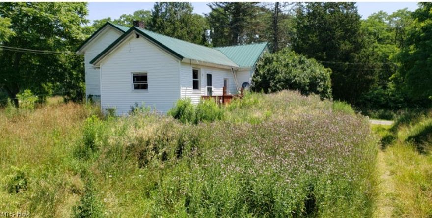Great potential in this farmhouse located on over 3 acres with bank barn! Needs work. Sold as-is.