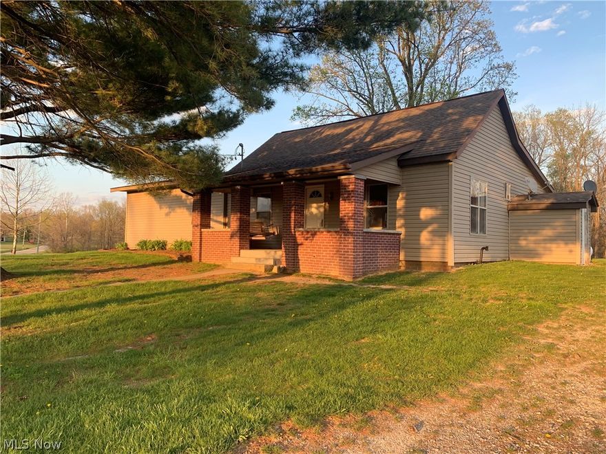 This 3 bedroom country home has small farm charm with a newer barn structure and board fenced field along with a detached oversized two car garage all on 3.88 acres. The eat in kitchen is nicely equipped and connects to a mud room area and exit to the back yard.  There are two large bedrooms and a cozy living space.  The outdoor spaces is efficiently used and boast a comfortable front porch area, and an extra wide concrete driveway leading to the two car garage. The home is an excellent opportunity to relax in a quiet setting or start your own small farming operation.