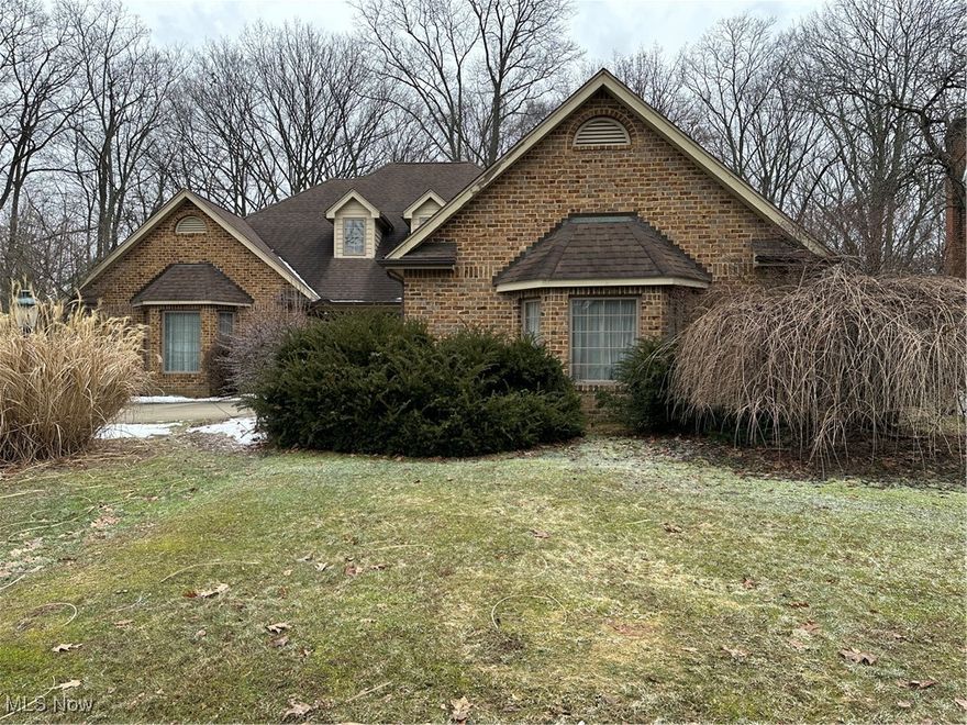 Contingent on house sale! Continue showing. All Brick 4 bedroom, 3 1/2 bath 2 Story home with the Master Bedroom and bath on the the first floor situated on a park-like setting. The 2 Story foyer takes you to the sunken formal living room with bookcases and bay window.  The kitchen features an island as a breakfast bar, also a built-in desk and a cozy dinette with a bay window to enjoy bird watching while sipping your coffee.  The sunken family room has a wood burning fireplace.  The dining room is being used as a studio and features Crown Molding and Chair Rail. First floor laundry.  Going up the beautiful open staircase you will find the three bedrooms and 2 full baths.  The basement has three studio rooms and a walk-out to the rear yard.  Private backyard and nice neighborhood.