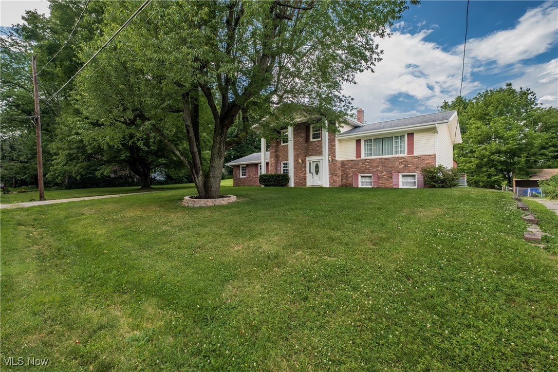 Welcome to this solid-build, Colonial Style Split Level Home, in the desirable area of Green Local School District, which also includes the additional adjacent parcel, expanding your outdoor living space to over a half acre! This home boasts 2,272 above grade SF of living area, with additional 520 SF of finished space in the lower level. In addition to the 4 bedrooms and 2 full baths, are the Family Room, the Eat-in Kitchen/Dining and Living Room featuring vaulted beamed ceilings, the lower level Laundry, and the Recreation Room which walks-out to the rear patio. Enjoy stepping out from the kitchen/dining room onto the large upper deck with your favorite beverage, and enjoy the peaceful view of the tree-lined backyard. Bring your person style and updates to this property offering great potential to make it your own!