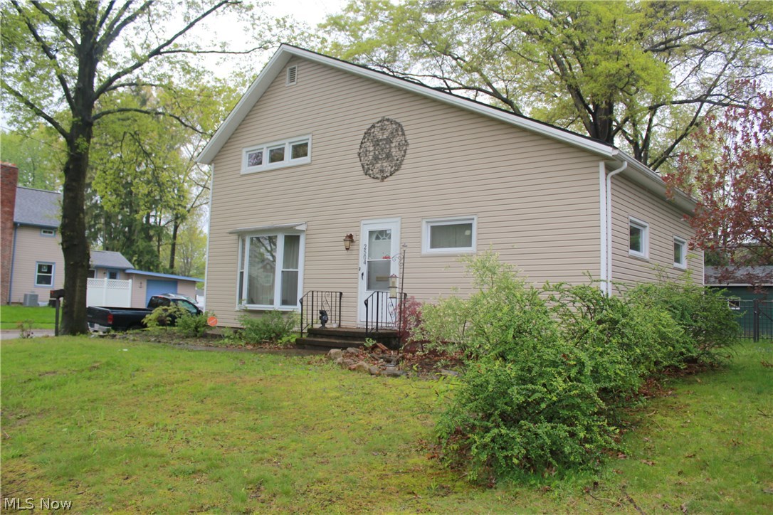 Charming home with 3 bedrooms and 2 full baths and a walk-out full basement comes with many recent updates and amenities including remodeled kitchen, and newly installed first floor laundry, new bathroom with whirlpool tub and shower, new siding, flashing, and gutters, and updated plumbing, all in 2015. Chimney was rebuilt in 2016 for functioning wood burning fireplace; windows updated in 2013. Very close to the newly developed Portage Crossings shopping and dining! Real hardwood floors throughout. 2 car detached garage. Beautifully fenced in backyard with covered deck. Appliances stay!