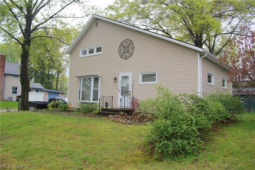 Charming home with 3 bedrooms and 2 full baths and a walk-out full basement comes with many recent updates and amenities including remodeled kitchen, and newly installed first floor laundry, new bathroom with whirlpool tub and shower, new siding, flashing, and gutters, and updated plumbing, all in 2015. Chimney was rebuilt in 2016 for functioning wood burning fireplace; windows updated in 2013. Very close to the newly developed Portage Crossings shopping and dining! Real hardwood floors throughout. 2 car detached garage. Beautifully fenced in backyard with covered deck. Appliances stay!