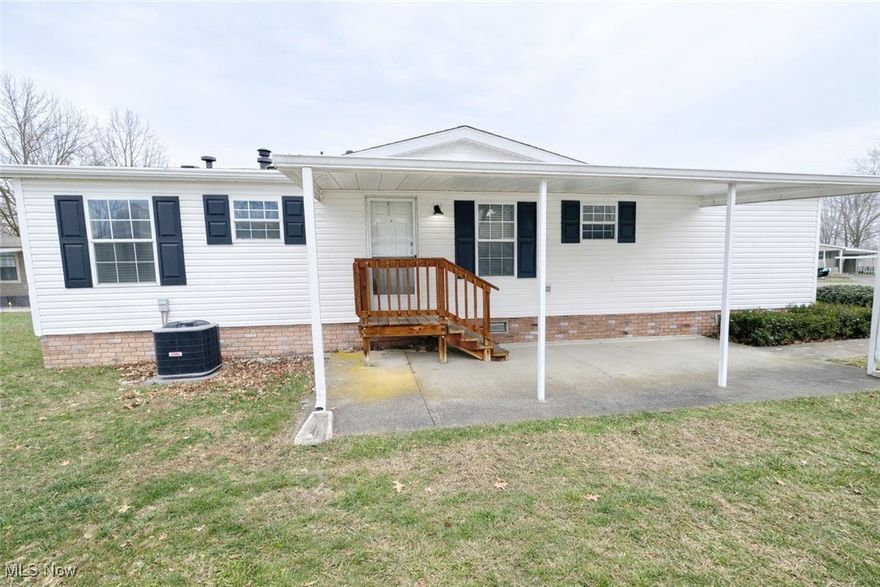 Located in a 55+ community, 178 D Street SW in Navarre offers convenient single-floor living on a quiet cul-de-sac. This well-laid-out home features 3 bedrooms and 2 full bathrooms, providing comfortable and functional living space. The laundry area is conveniently located just off the fully applianced kitchen for ease of daily living. The lot lease includes water, trash service, and street cleaning, helping simplify monthly expenses. Enjoy a low-maintenance lifestyle in a peaceful setting with easy access to local amenities.  Home features a new roof, new central air, new concrete driveway and new motherboard in furnace.