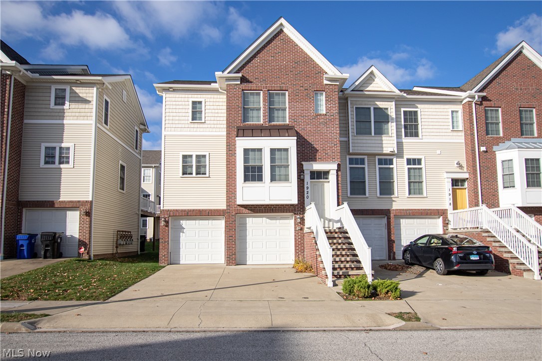 Welcome to 1920 East 86th Street! This beautiful townhome is just steps from the Cleveland Clinic campus. Step inside to discover a bright eat-in kitchen with tons of counter space and stainless steel appliances. The dining room is a perfect space to host family and friends, with a door leading to a balcony. Pass by a half-bath and into the light-filled living room with a gas fireplace, which leads upstairs. The spacious primary bedroom offers French doors and a large ensuite bathroom. Two additional bedrooms share a full bathroom to complete the third floor. The lower level features a laundry room with a utility sink, garage access, and a flex room for storage or additional living space. Located within Cleveland's University Circle, steps from Case Western Reserve University, Cleveland Clinic and University Hospitals, museums, and restaurants. Minutes from downtown Cleveland and highway access.