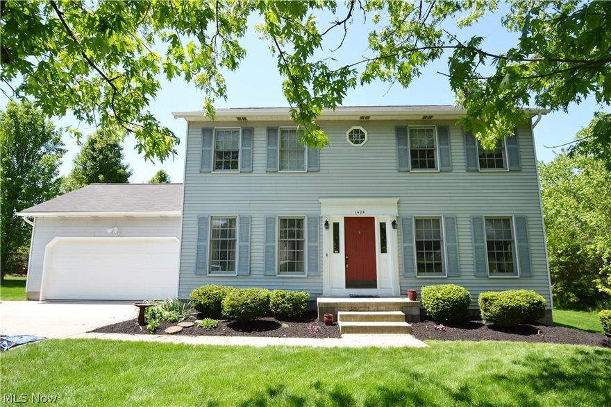 Great location for this 4 bedroom 2.1 bath colonial in Hudson. Located in Carriage Hill Estates the rear yard with it's large covered and screened porch leads to the open deck with a private treed yard. Off the front foyer you will see the large family room with wood burning fireplace and on the other side of this center hall colonial there is a formal dining room currently being used as an office. The large spacious kitchen has a center island great for eating snacks or just watching the cook do their job.This kitchen has plenty of space for a kitchen table and chairs. No wallpaper here as it has all been removed and walls freshly painted in April 2016. The microwave is about 2 years & the dishwasher is only about 5 years young. The stove and refrigerator are also newer.  The second floor features a master bedroom with private bath as well as 3 additional bedrooms, one used as an office, and a second full bath with skylight. On the lower level there is a great family or media room and