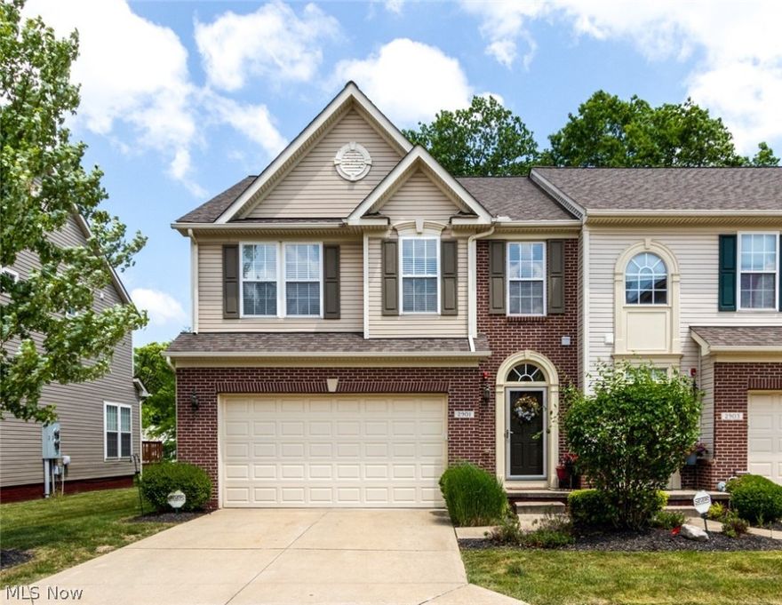 Love at first sight! This welcoming home is perfect on so many levels! Step inside - your gaze is drawn through the gracious foyer to the open Great Room - and what a GREAT room it is... seamless, open flow to the gourmet kitchen, custom bump-out providing oversized dining area, and access to the back deck overlooking a park-like setting... No matter what season - there is plenty to be enjoyed, either outdoors or relaxing by the fireplace... Beautiful hardwood floors and stunning fixtures highlight the kitchen, which features generous expanses of granite - the chef will share in conversations and laughter while preparing meals or snacks!  Upstairs - three large bedrooms with treetop views.  For the owners - a magnificent bedroom, accented with a tray ceiling, luxe ensuite bathroom, and generous closet space... a tranquil retreat... Two additional bedrooms with an additional updated full bath, and a laundry room complete the second floor. The family room in the lower level - just the sp